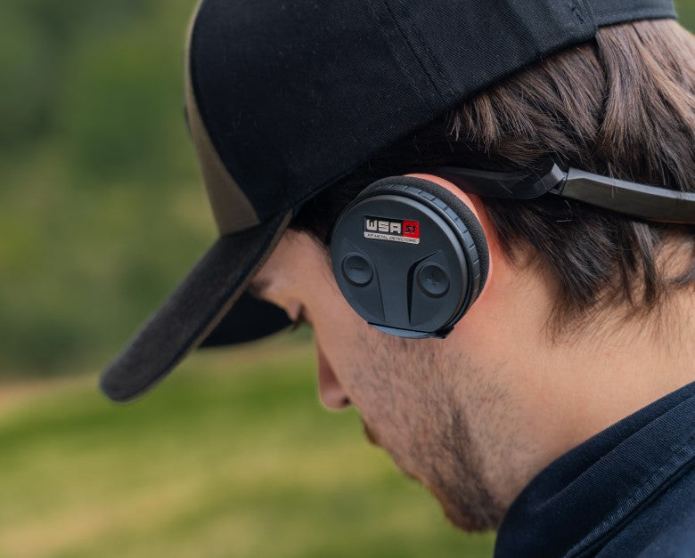 Detectorist wearing XP WSA-ST wireless headphones in the field