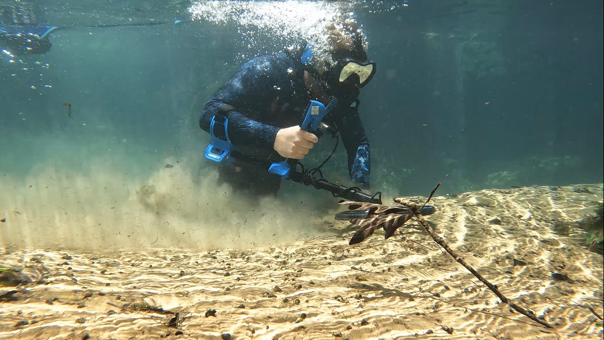 Brandon Nicholas of Adventure Archaeology water detecting with the Garrett Vortex VX9