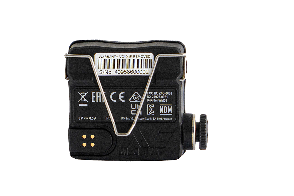 Minelab WM09 wireless module back view with clip and magnetic charging contacts