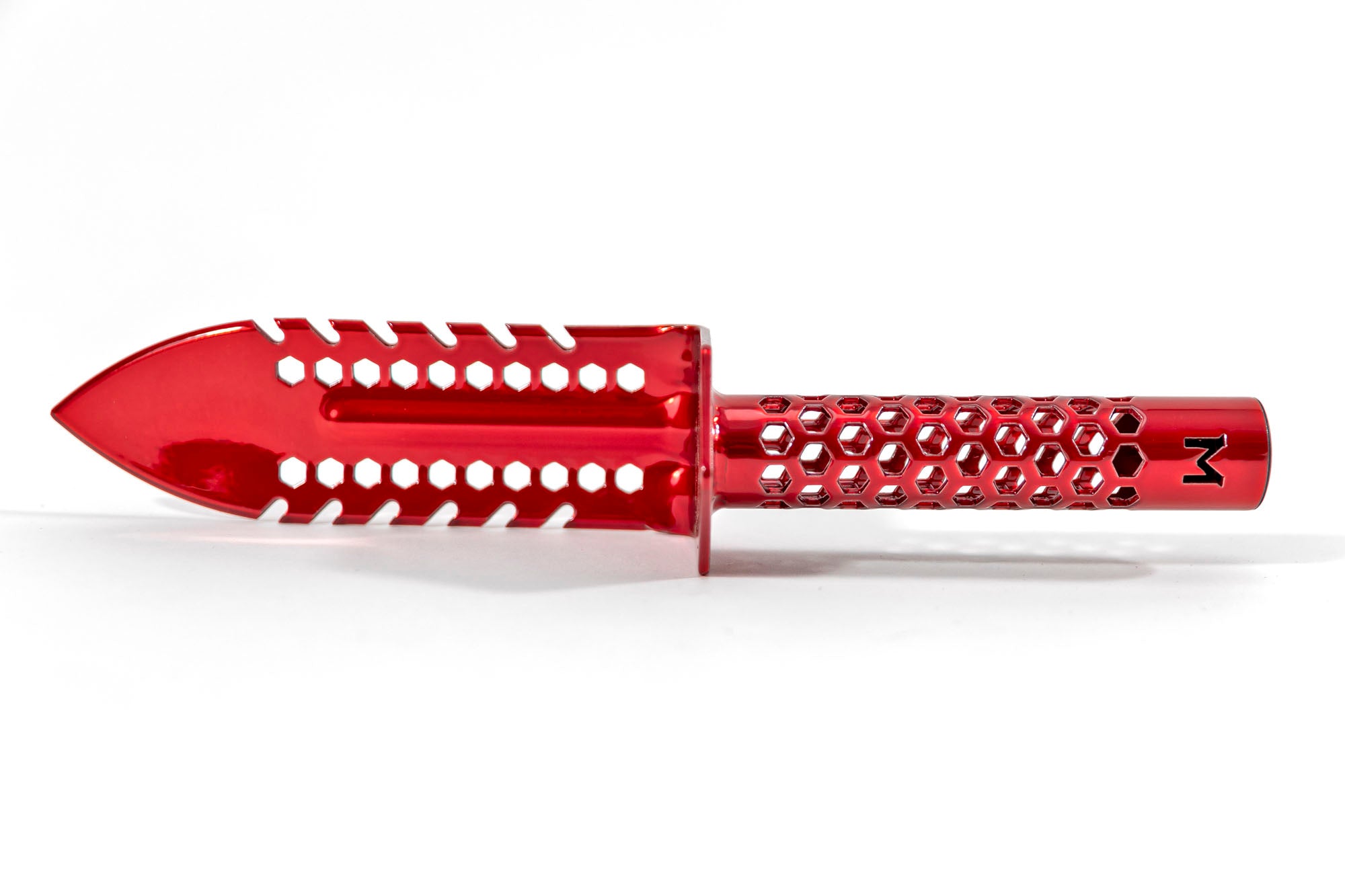 Side profile of the Motley Grass Knife showing cutting teeth on both sides of the blade and the handguard